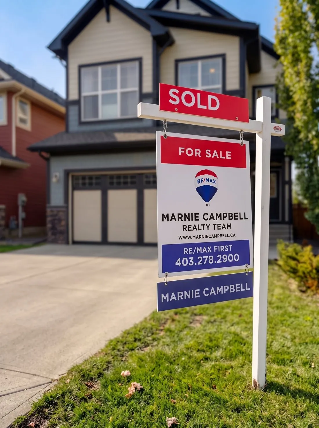A two-storey Mahogany home with a SOLD sign from the Marnie Campbell Real Estate Team